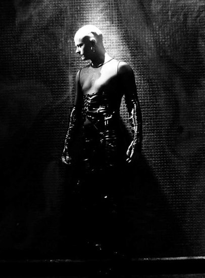 Black-and-white portrait of a performer on stage