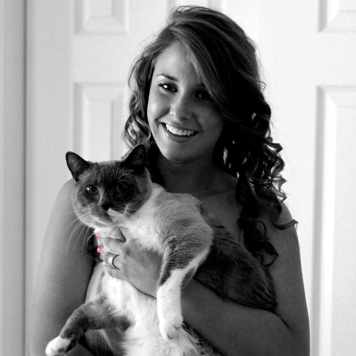 Black-and-white portrait of a woman holding a cat